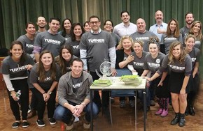 A group of people all wearing gray shirts Volunteering at The New Jewish Home