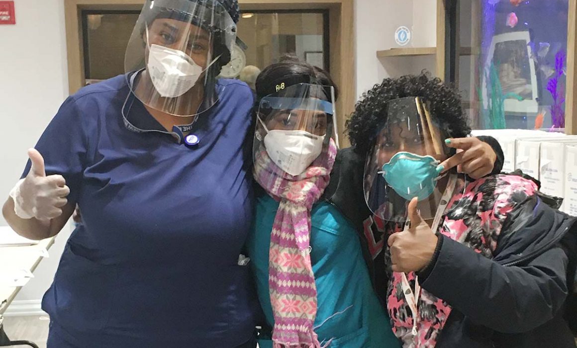 health care workers with protective masks and face shields